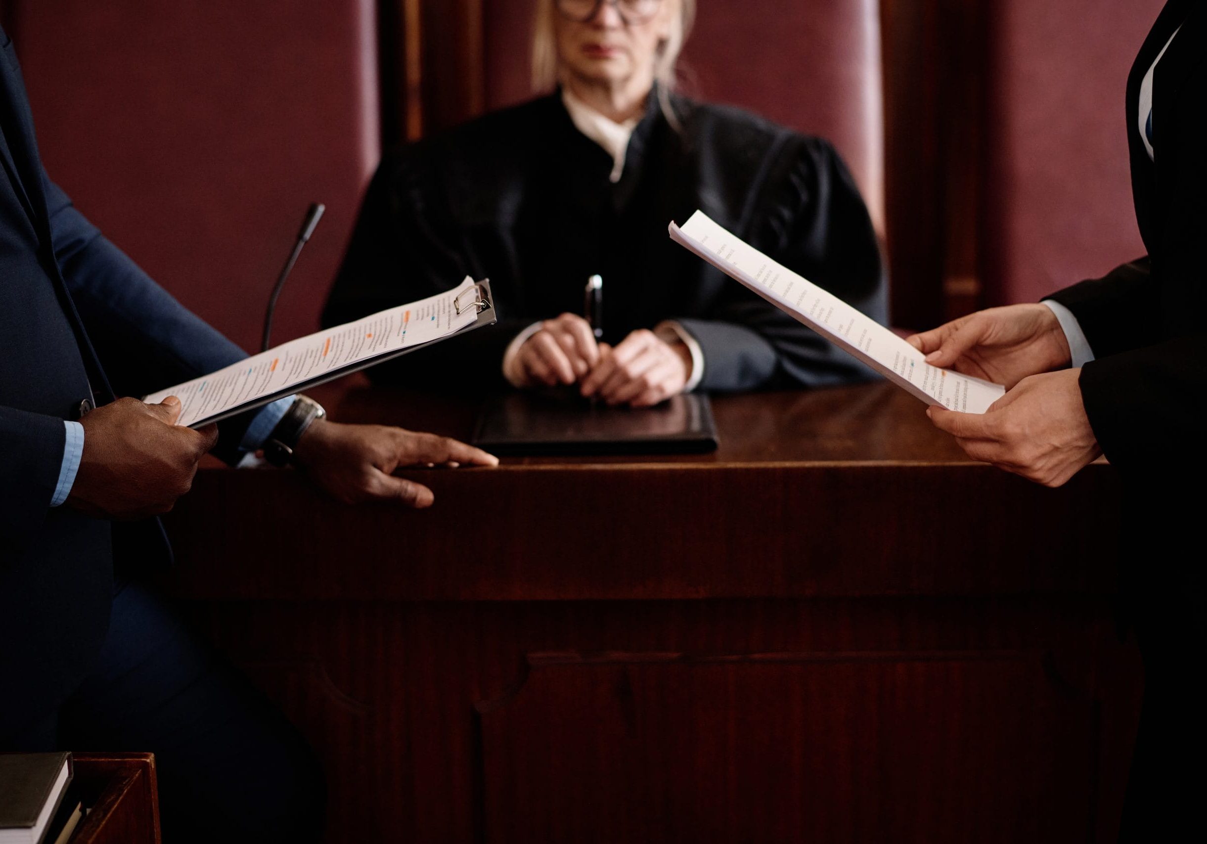 closeup-prosecution-defense-sides-with-juridical-documents-standing-opposite-each-other