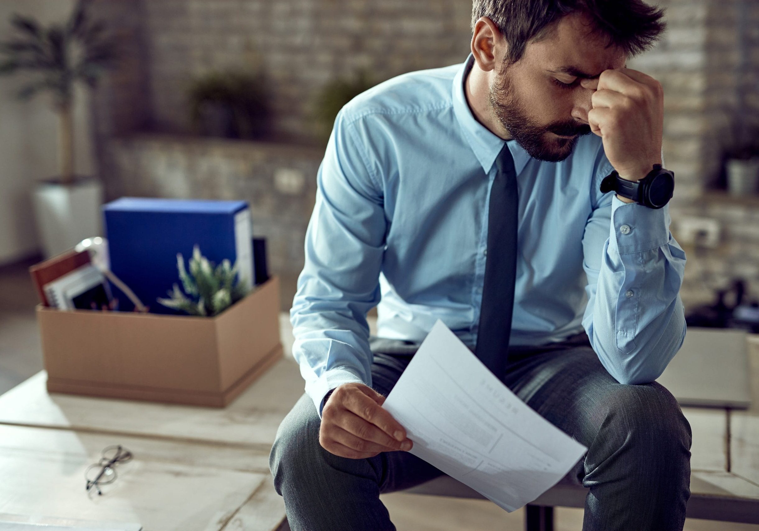 young-frustrated-businessman-holding-his-head-pain-after-being-fired-work